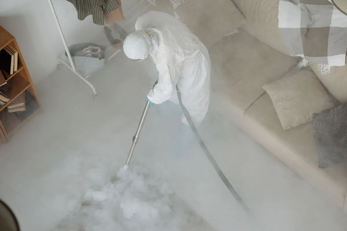 Biohazard cleanup technician in protective equipment, Taylor, MI